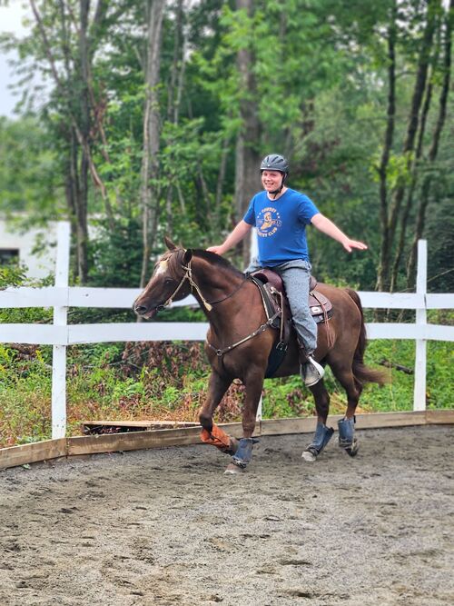 horse back riding in a ring