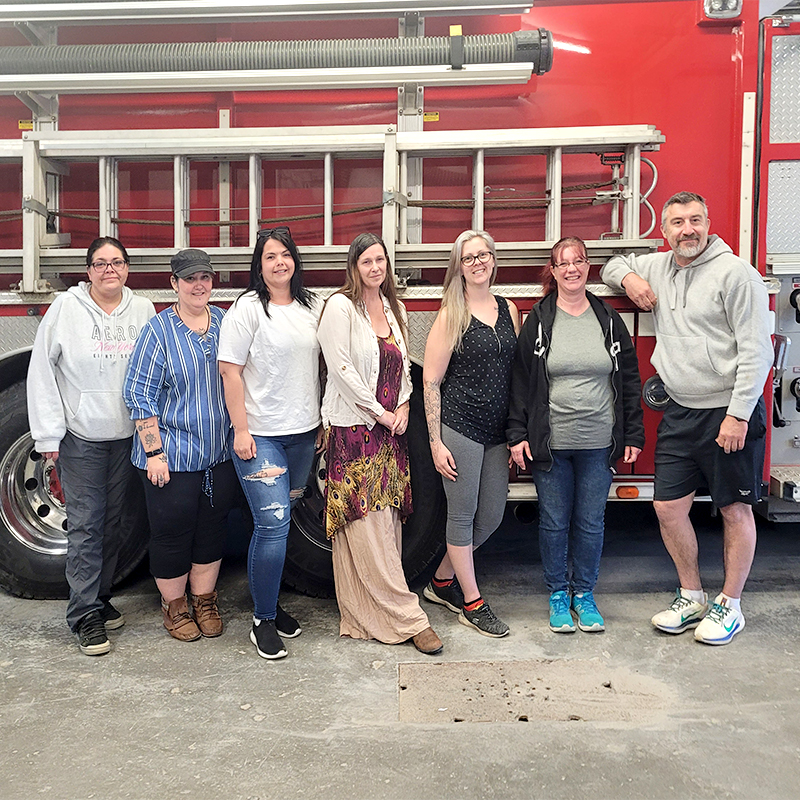 Posing in front of a firetruck