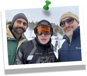 photo of member and staff on ski hill