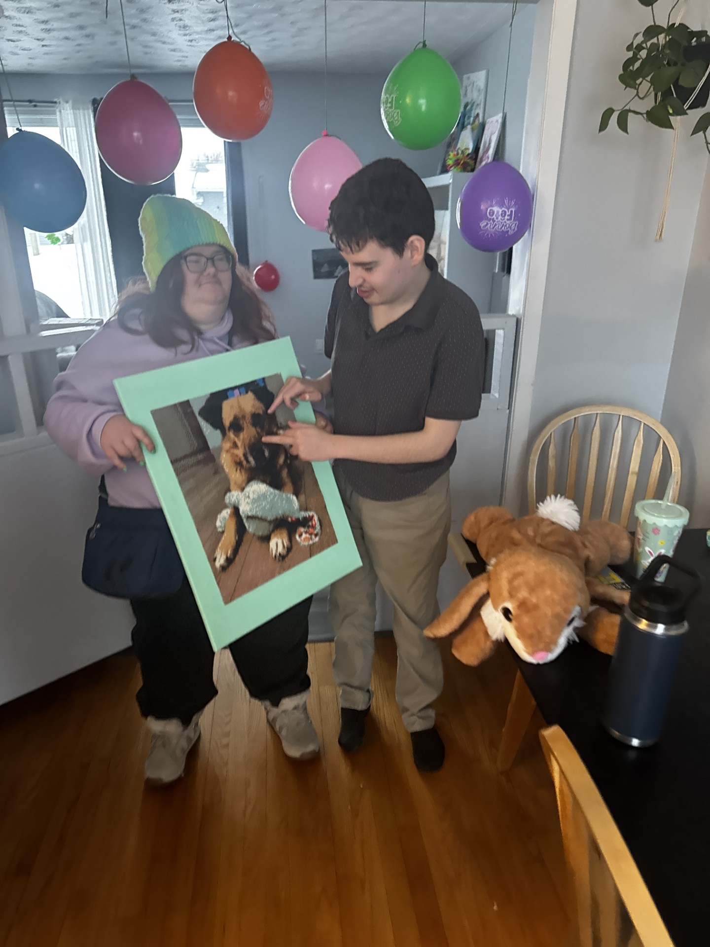 SL presents JSO with a gem painting that she made for his Birthday of Piper the Dog.